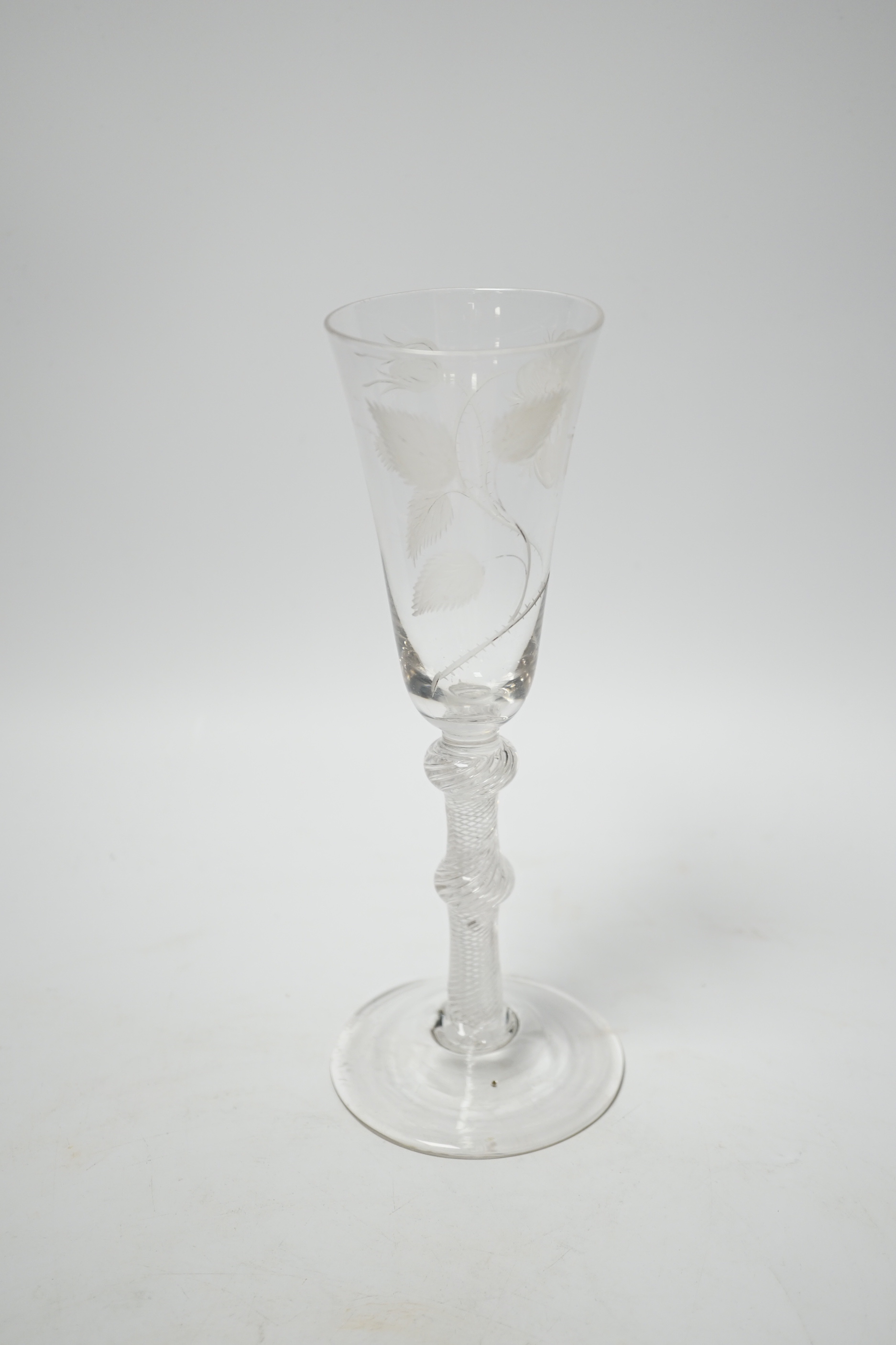 An 18th century Jacobite ale glass with double knop and air twist stem, engraved with a rose, 20.5cm